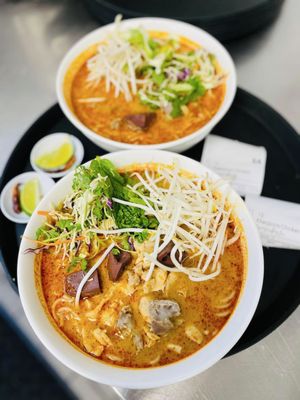 Photo of Spicy Joi Banh Mi-Noodles-Lao Street Food - Concord, CA, US. Authentic Khaopoon (curry vermicelli noodle) soup with gizzards & pork blood cubes