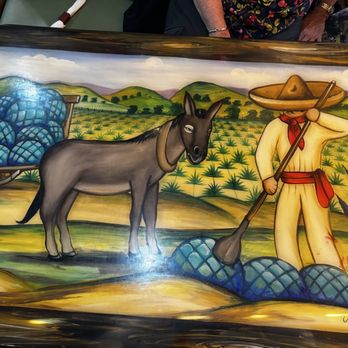 Raymi Cuisine - A booth back made of carved wood, hand painted, lovely to look at while eating. - Mexican Near Me - Louisville, Kentucky Raymi Cuisine - A booth back made of carved wood, hand painted, lovely to look at while eating. - Mexican Near Me - Louisville, Kentucky