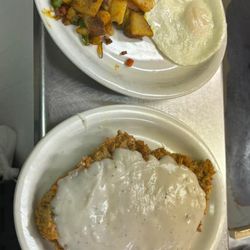 Chicken fried steak, eggs,and home fries