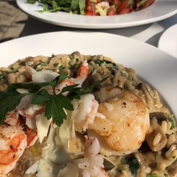Cafe Istanbul - Sea scallops, shrimp, rice, mushrooms, nuts and salad with tomatoes, cucumbers, parsley - Turkish Near Me - Chicago, Illinois Cafe Istanbul - Sea scallops, shrimp, rice, mushrooms, nuts and salad with tomatoes, cucumbers, parsley - Turkish Near Me - Chicago, Illinois