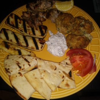 Underhill Cafe - Takeout flow (clockwise): zucchini croquettes, tomato, pita bread, grilled haloumi and grilled chicken skewers with a dip. - Greek Near Me - Brooklyn, New York