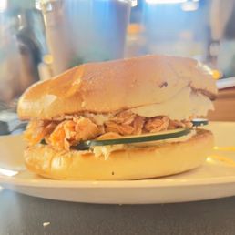 Lemon dill cream cheese, smoked salmon, and cucumbers on a bagel. Lemon dill cream cheese, smoked salmon, and cucumbers on a bagel.