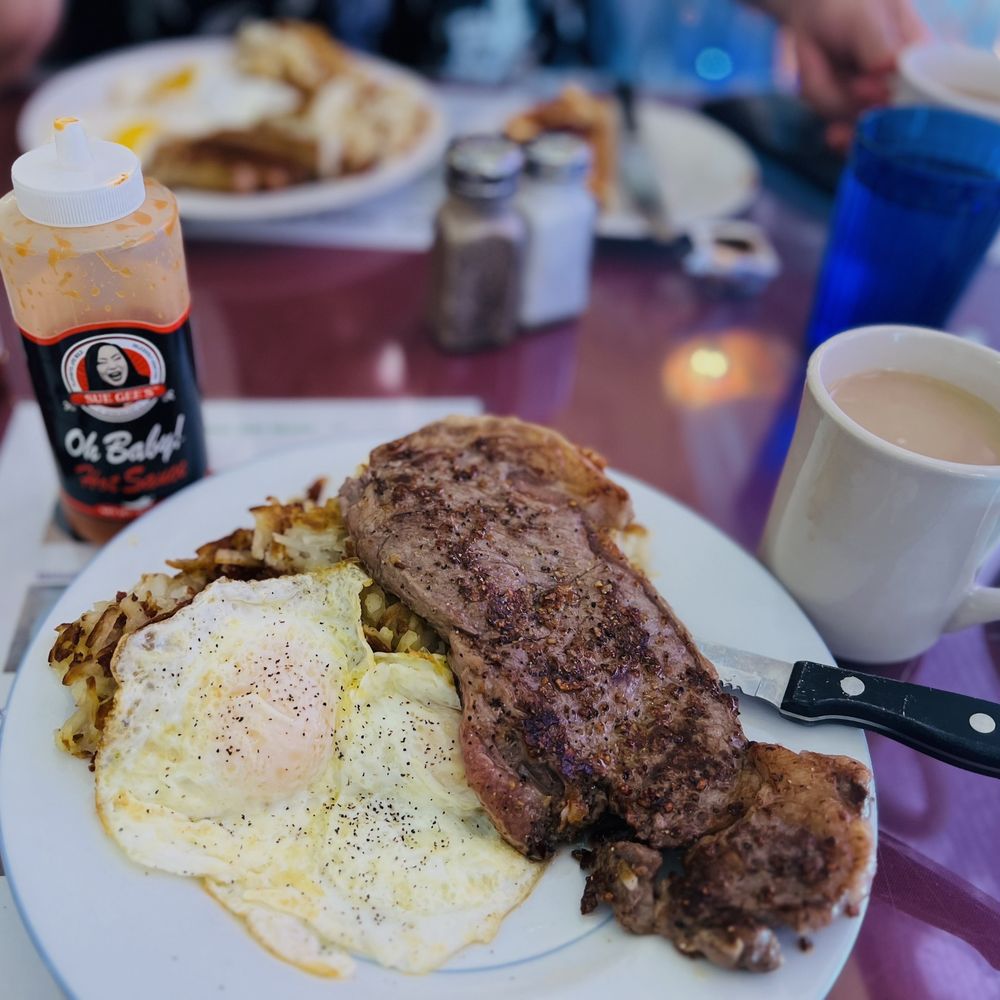 Cameo Cafe - Medium Rare NY steak, eggs over medium, hashbrowns and of course SUE GEE'S AMAZING hot sauce - Breakfast & Brunch Near Me - Portland, Oregon Cameo Cafe - Medium Rare NY steak, eggs over medium, hashbrowns and of course SUE GEE'S AMAZING hot sauce - Breakfast & Brunch Near Me - Portland, Oregon