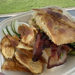 BLT on Focaccia with freshly fried potato chips BLT on Focaccia with freshly fried potato chips