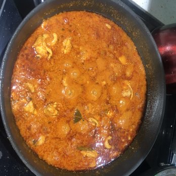 Butter Chicken - a skillet on a stove top - Indian Near Me - Toronto, Ontario