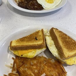 Our breakfast! Breakfast sandwich with has browns and sausage, sunny side up eggs cooked perfectly. Our breakfast! Breakfast sandwich with has browns and sausage, sunny side up eggs cooked perfectly.