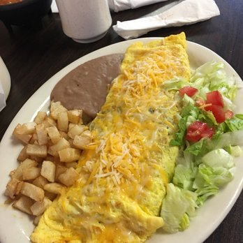 Big Ray's Cafe - an omelet with a side of potatoes and lettuce - Mexican Near Me - Pharr, Texas