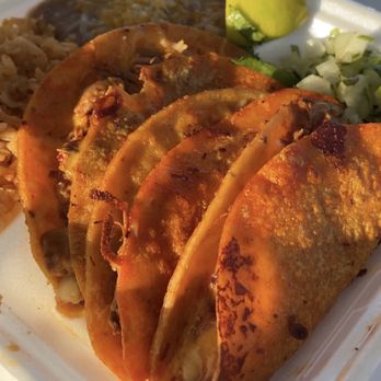 Tacos El Primo - Quesobirria plate - such a good deal. Three birria tacos with consommé, rice and beans, onions and cilantro, lime, and salsa. - Tacos Near Me - Garland, Texas