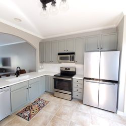 My Favorite Painters - My costumer was so happy with how her kitchen turned out after refinishing the cabinets and painting the walls.