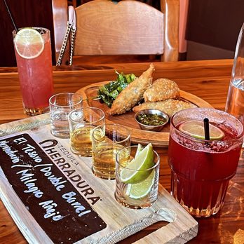 Casa Del Toro - Tequila flight w/mushroom empanadas in the back. - Latin American Near Me - Hayward, California
