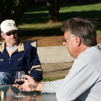 Coleman Vineyard - two men having a glass of wine - Wine Tasting Room Near Me - McMinnville, Oregon