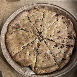Cousin Vinny's Pizza - 8" Freshly Baked Chocolate Chip Cookie, perfection. Keep it in the foil & heat it up the next day too. So rich!