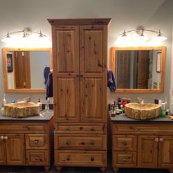 Grand Valley Home Solutions - Petrified wood sinks and hickory cabinets