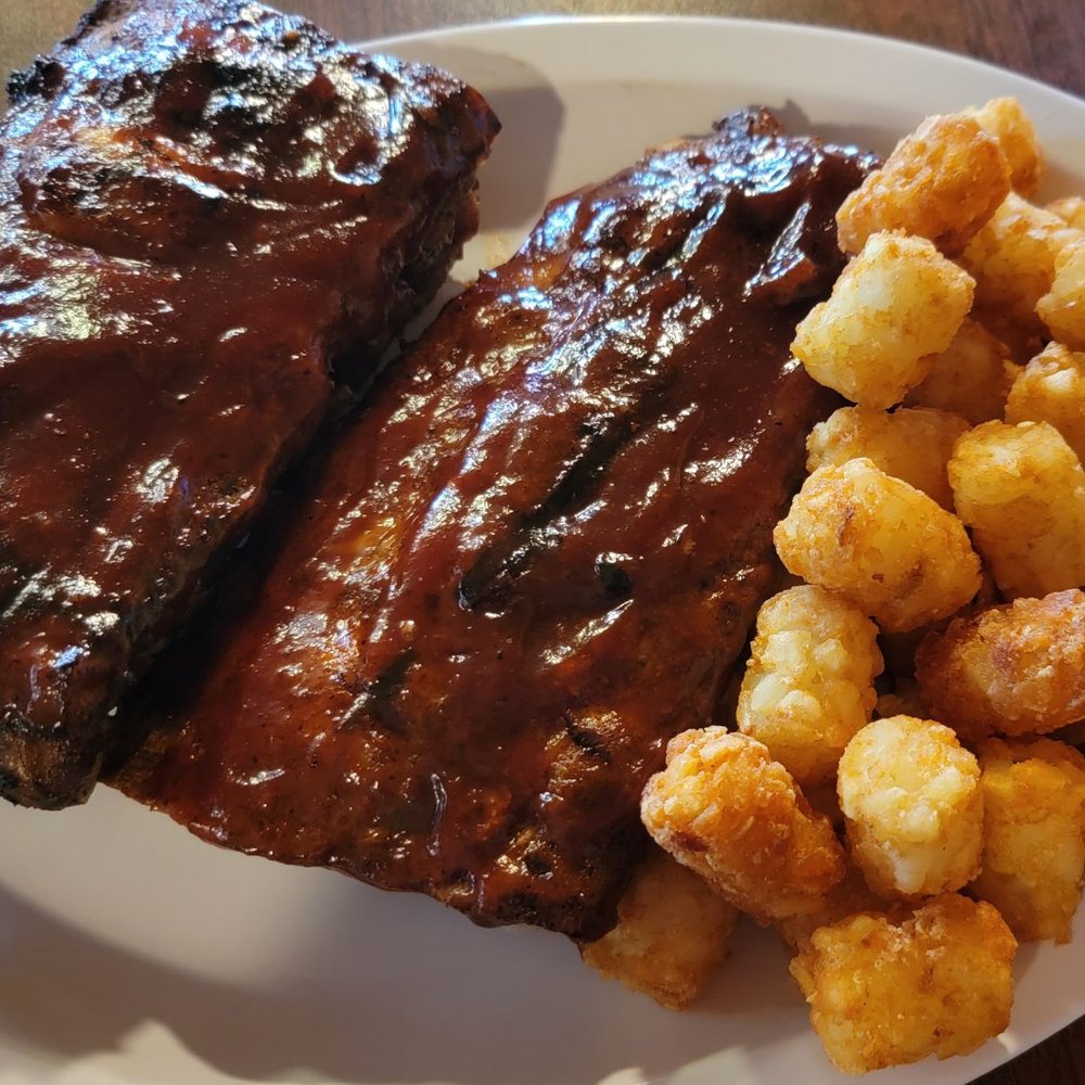 The Hideaway Pub & Eatery - Full rack of baby back ribs with tater tots - American Near Me - Franklin, Wisconsin The Hideaway Pub & Eatery - Full rack of baby back ribs with tater tots - American Near Me - Franklin, Wisconsin