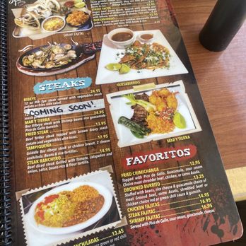 Oasis Cafe - Menu - The menu includes sections for tacos, steaks, and popular dishes. Tacos are priced at $16.95, with options like ribeye street tacos and carne asada. Steak options include ribeye, mar y tierra, fried steak, and more, with prices ranging from $13.95 to $24.95. Favorites include fried chimichangas, burritos, chicken fajitas, steak fajitas, and shrimp fajitas, with prices from $12.95 to $16.95. The menu features images of some dishes and uses colorful text and backgrounds to organize the offerings. - Salad Near Me - Belen, New Mexico