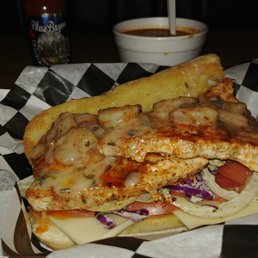 Cajun dusted swordfish, served over a roasted sweet pepper and basil infused slaw. Topped with a shrimp scampi sauce. Cajun dusted swordfish, served over a roasted sweet pepper and basil infused slaw. Topped with a shrimp scampi sauce.