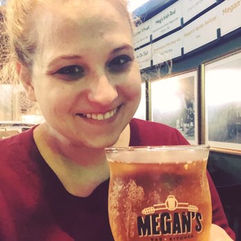 Megan's - Megan holding a Megan's cider - Irish Pub Near Me - New York, New York