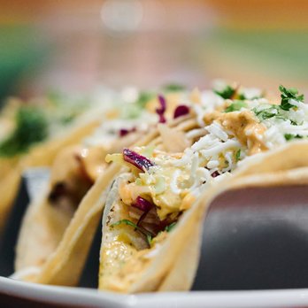 bellagreen - three tacos on a plate - New American Near Me - Dallas, Texas