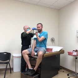 Ormond Beach Urgent Care - Cleaning out his ear! The tech did amazing!