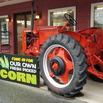 Chase Farms - a red tractor parked in front of a store - Fruits & Veggies Near Me - Wells, Maine Chase Farms - a red tractor parked in front of a store - Fruits & Veggies Near Me - Wells, Maine