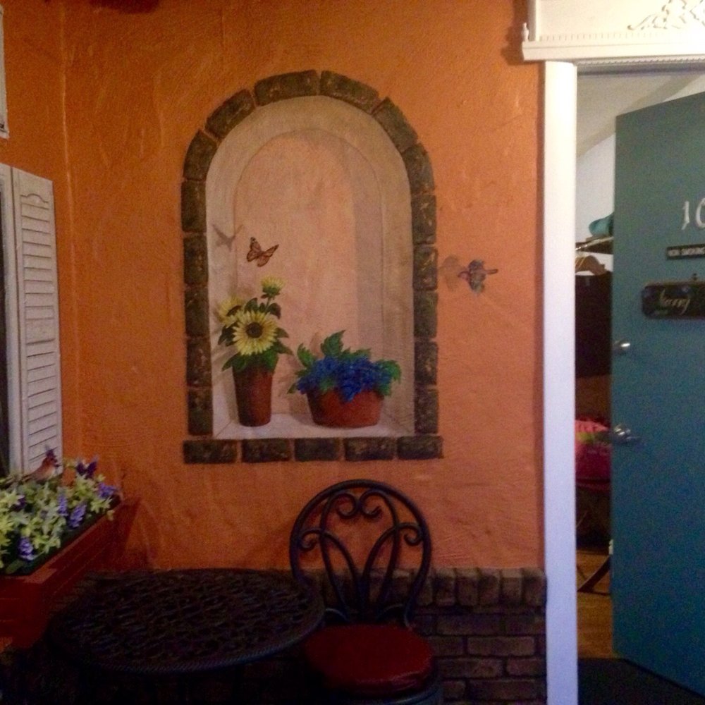 Outside sitting area with mural