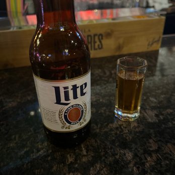 Honor Brewing Kitchen - a glass of beer and a lite bottle - New American Near Me - Fairfax, Virginia Honor Brewing Kitchen - a glass of beer and a lite bottle - New American Near Me - Fairfax, Virginia