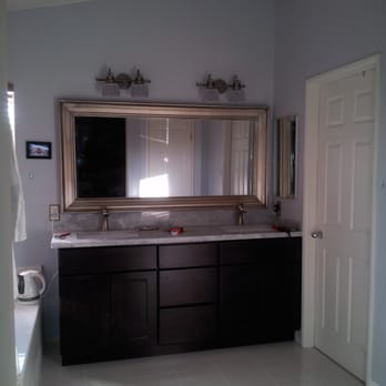 Redesign Construction - New espresso vanity with carrera marble. - General Contractors Near Me - Garden Grove, California