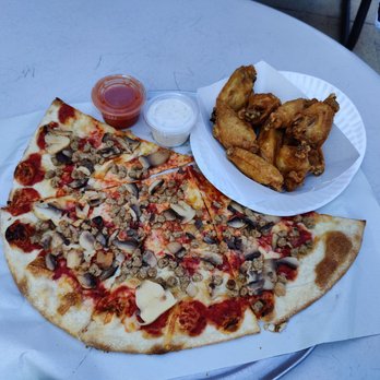 Piezanos - a plate of chicken wings and mushroom pizza - Pizza Near Me - Ocean City, Maryland