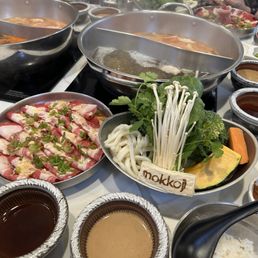 Split Pot with Original Broth, Brisket, Vegetables, and Dipping Sauce Split Pot with Original Broth, Brisket, Vegetables, and Dipping Sauce