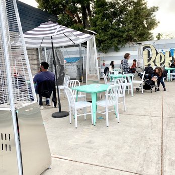 Temescal Brewing - a patio with tables and chairs - Beer Gardens Near Me - Oakland, California Temescal Brewing - a patio with tables and chairs - Beer Gardens Near Me - Oakland, California
