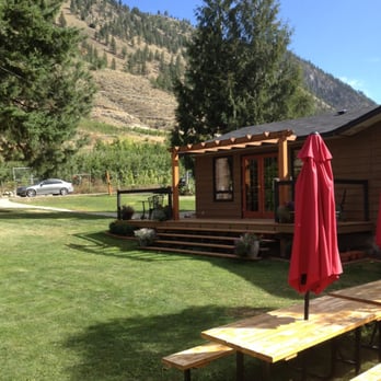 Forbidden Fruit Winery - View from riverfront deck looking back towards tasting room. - Wineries Near Me - Cawston, British Columbia Forbidden Fruit Winery - View from riverfront deck looking back towards tasting room. - Wineries Near Me - Cawston, British Columbia