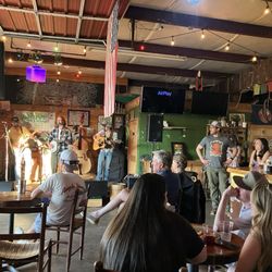 Golden Grove Brewery - The bar, stage, front tables with unseen booths to the side beside the huge open doorway with a few more tables out front