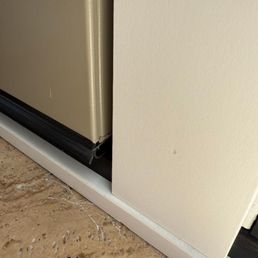 Door protruding inward, not flush to frame.