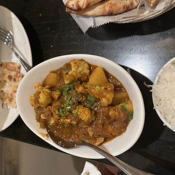 Pista House Indian Cuisine - a bowl of curry and a plate of rice - Indian Near Me - Reston, Virginia
