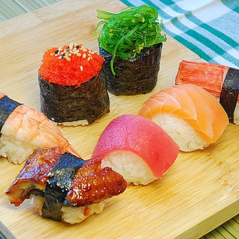 Tubomi Sushi - a variety of sushi on a cutting board - Sushi Bars Near Me - Lachine, Quebec Tubomi Sushi - a variety of sushi on a cutting board - Sushi Bars Near Me - Lachine, Quebec