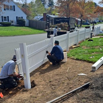 Leonels Landscaping - two men working on a fence - Landscaping Near Me - Lynn, Massachusetts