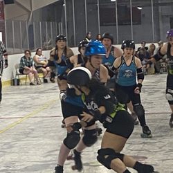 Circle City Derby Girls - Circle city pivot, "Diamond", blocking the jammer on opposing team