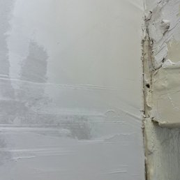 Not smooth or sealed at all. This wall isn't supposed to be textured at all. It's not supposed to have gaps either.
