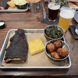 Railroad Ribs with collard greens and hushpuppies, and cornbread of course Railroad Ribs with collard greens and hushpuppies, and cornbread of course