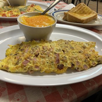 The Egg Factory - The Meat Lovers omelette with cheese grits and white toast - Diners Near Me - Lakeland, Florida The Egg Factory - The Meat Lovers omelette with cheese grits and white toast - Diners Near Me - Lakeland, Florida