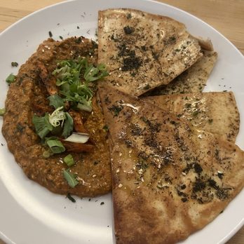 Baba Nahm - Muhamarra: Roasted Sweet Peppers, Harissa Carrots, Herbs, Pomegranate, Crispy Laffah Bread - Desserts Near Me - Asheville, North Carolina Baba Nahm - Muhamarra: Roasted Sweet Peppers, Harissa Carrots, Herbs, Pomegranate, Crispy Laffah Bread - Desserts Near Me - Asheville, North Carolina