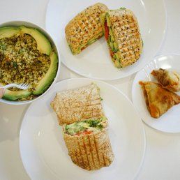 a plate of sandwiches and a bowl of salad