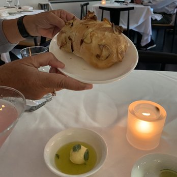 Ostra - Crispy hot bread with sage butter steeped in olive oil - Seafood Near Me - Boston, Massachusetts Ostra - Crispy hot bread with sage butter steeped in olive oil - Seafood Near Me - Boston, Massachusetts