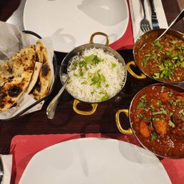 Garlic naan, rice, goat curry, chicken vindaloo Garlic naan, rice, goat curry, chicken vindaloo