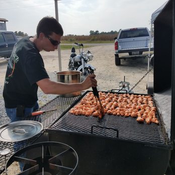 Pitchers Bar - a man cooking food on a grill - Music Venues Near Me - Benson, North Carolina Pitchers Bar - a man cooking food on a grill - Music Venues Near Me - Benson, North Carolina