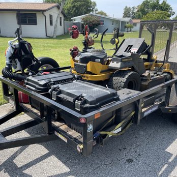 Tony's Turf - a lawn mower with a trailer attached to it - Lawn Services Near Me - Daytona Beach, Florida Tony's Turf - a lawn mower with a trailer attached to it - Lawn Services Near Me - Daytona Beach, Florida
