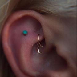 Studio Six26 - Healed rook piercing with a 14kt rose gold hoop & charm