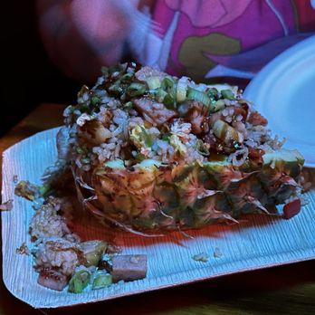Stowaway - Delicious Pineapple Fried Rice served in a pineapple shell. - Tiki Bars Near Me - Tustin, California
