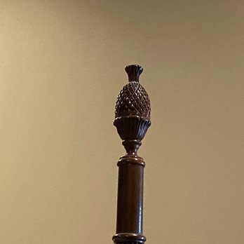 Historic Kahn Hotel - Pineapple on bedpost - pineapples are for hospitality - Hotels Near Me - Jefferson, Texas