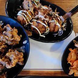 three bowls of food on a tray